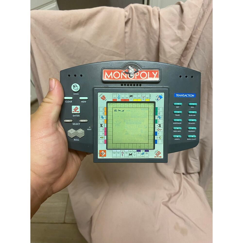 Monopoly 1997 Hasbro Electronic Handheld Game Parker Brothers Tested and Works
